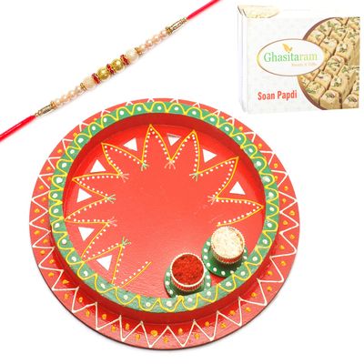 Ghasitaram Gifts Rakhi Gifts for Brothers Rakhi Pooja Thalis- Reflection of Love with Pearl Rakhi with 200 GMS of Soan Papdi