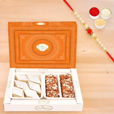Ghasitaram Gifts Rakhi Gifts for Brothers Rakhi Sweets - Box of Kaju Katli and Dodha Barfi with Pearl Beads Rakhi