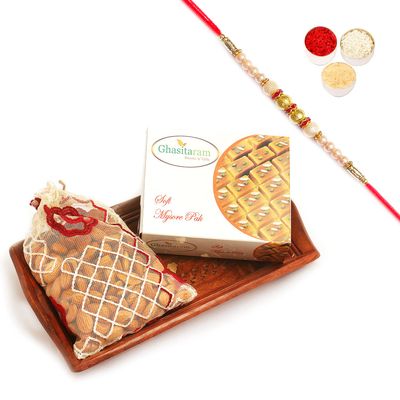 Ghasitaram Gifts Rakhi Gifts for Brothers Small Wooden Serving Tray with Soft Mysore Pak, and Almonds with Pearl Rakhi