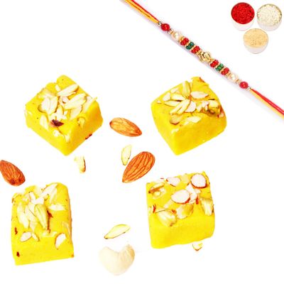 Ghasitaram Gifts Rakhi Gifts for Brothers Rakhi Sweets - Kesar mawa barfi 400 GMS with Beads Rakhi