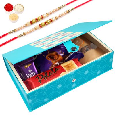 Jaiccha Ghasitaram Rakhi Gifts for Brothers - Blue Rectangular Box of Milk Chocolates,Caramel Toffees, Chocolates , Chocolate Almonds, Potata Biscuits with 2 Pearl Rakhis