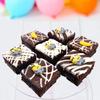 Limited Edition Chocolate Fudge Brownies - 9 Chocolate Fudge Brownies Topped with Edible Sugar Decorations and White Chocolate and Vanilla Icing. Serves 9 portions. Baked by bakerdays (Minion) view 2