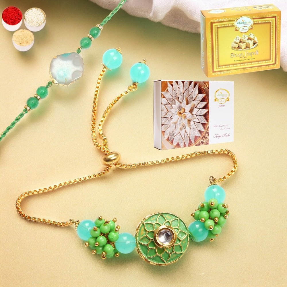 Ghasitaram Gifts Rakhis Online - Rakhi for Brother-T-12 Green Stone Bhaiya Bhabhi Rakhi with 200 GMS of Kaju katli and 200 GMS of Soan Papdi