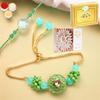 Ghasitaram Gifts Rakhis Online - Rakhi for Brother-T-12 Green Stone Bhaiya Bhabhi Rakhi with 200 GMS of Kaju katli and 200 GMS of Soan Papdi view 1