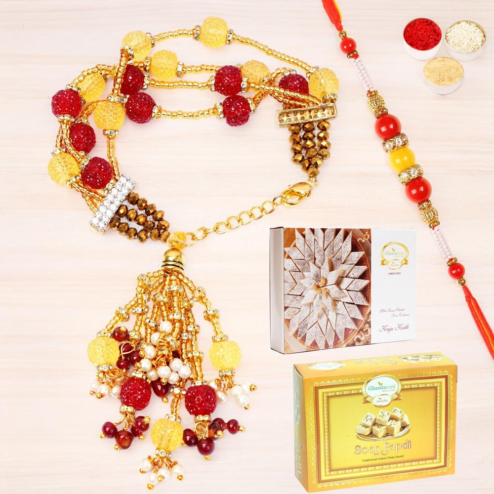 Ghasitaram Gifts Rakhis Online - Rakhi for Brother-RM-205 Bhaiya Bhabhi Rakhi with 200 GMS of Kaju katli and 200 GMS of Soan Papdi