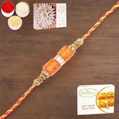 Ghasitaram Gifts Rakhi for Brother Rakhis Online - RM598 - Orange Stone Bracelet Rakhi with 200 GMS of Besan Barfi and 200 GMS of Kaju Katli