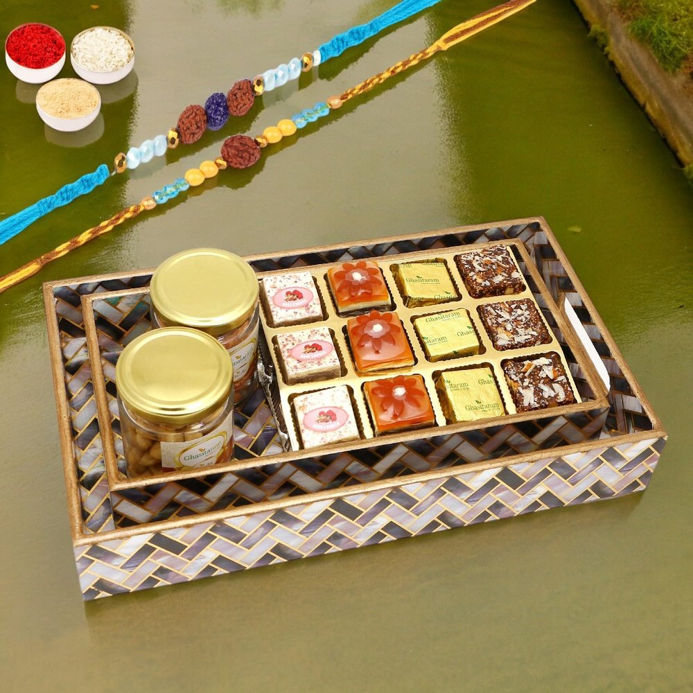 Ghasitaram Gifts Rakhi Gifts for Brothers Set of 2 Printed Blue Trays of Assorted Bites, Roasted Cashews and Almonds Jars with 2 Blue Rudraksh Rakhis