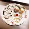 Ghasitaram Gifts Rakhi Gifts for Brothers White Wooden Thali with Chocolate Almonds, Crunchy Cashews and Bhaiya Bhabhi Rakhis view 1