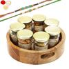 Ghasitaram Gifts Rakhi Gifts for Brothers Round Printed Wooden Tray of 7 Jars with 2 Green Beads Rakhis view 1