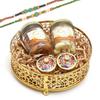 Ghasitaram Gifts Rakhi Gifts for Brothers Round Basket of Jars of Cashews, Almonds, Roli Chawal Containers and 2 Rakhis view 1
