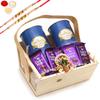 Jaiccha Ghasitaram Rakhi Gifts for Brothers Small Acrylic Basket of 9 Goodies with 2 Pearl Rakhis view 1