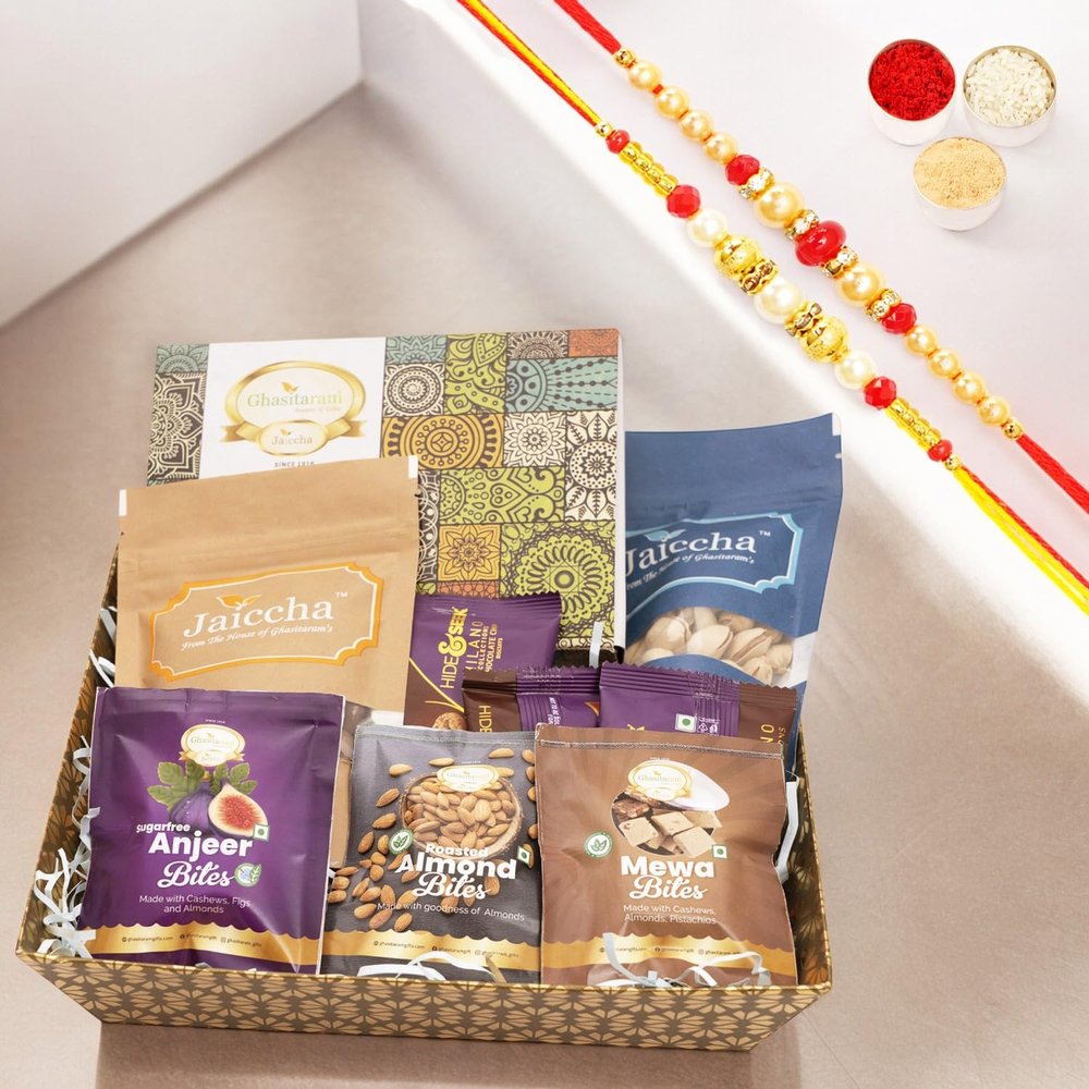 Ghasitaram Gifts Jaiccha Rakhi Gifts for Brothers - Brown Medium Tray of 9 Goodies with Milk Cake with 2 Rakhis
