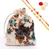Ghasitaram Gifts Jaiccha Rakhi Gifts for Brothers - Printed Jute Pouch with Bites and Cookies with 2 Rakhis view 1