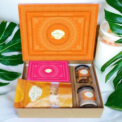 Ghasitaram Gifts Jaiccha Holi- Sweets/Holi Hampers/Thandai Ghasitaram Orange Hamper Box with Gujiyas, Thandai, Bhakarwadi, and Butter Chakli Pouch