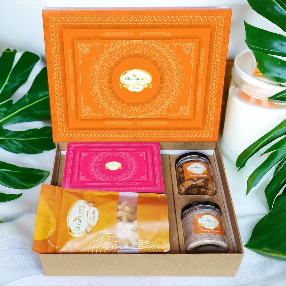 Ghasitaram Gifts Jaiccha Holi- Sweets/Holi Hampers/Thandai Ghasitaram Orange Hamper Box with Gujiyas, Thandai, Bhakarwadi, and Butter Chakli Pouch