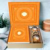Ghasitaram Gifts Jaiccha Holi- Sweets/Holi Hampers/Thandai Ghasitaram Orange Hamper Box with Sugarfree Wheat Gujiyas, Wheat Puffs and Moong Chakli view 1