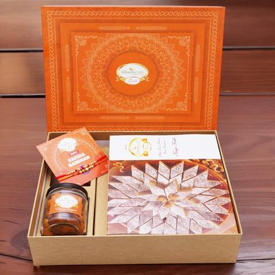 Ghasitaram Gifts Jaiccha Rakhi Gifts for Brothers Orange Hamper Box with Kaju Katli, 2 Rakhis, Card, and Mixed Dryfruit Jar