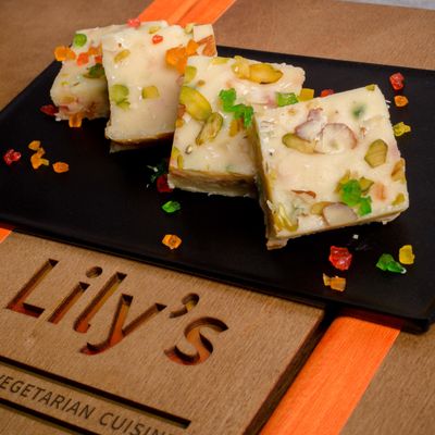 Savor the sweetness of life with Lily's Tutti Frutti Barfi, where every morsel celebrates the artistry of flavors a dessert worthy of your sweetest moments serving 6 piece and Approximent weight 370g