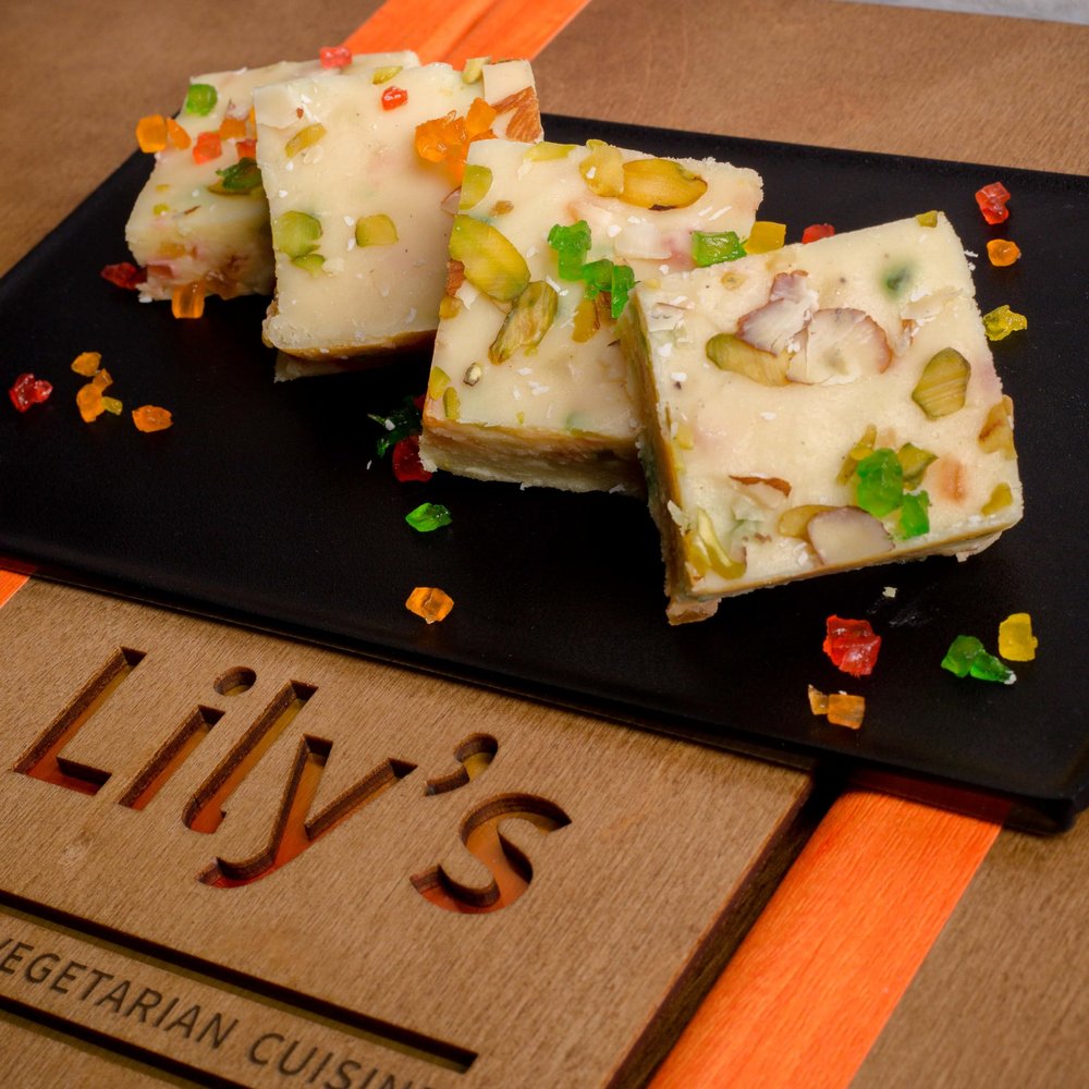 Savor the sweetness of life with Lily's Tutti Frutti Barfi, where every morsel celebrates the artistry of flavors a dessert worthy of your sweetest moments serving 6 piece and Approximent weight 370g