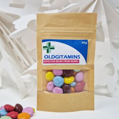 Anti-Farting Anti-Moaning Old-Git Pills Gag Gift Novelty Sweet Bag Funny Birthday Surprise Chocolate Treat Bag Joke Chocolate Present - OLDGITAMINS Sticker with Filled Brown Bag