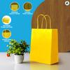 Nationwide Paper 200 Small Yellow Paper Bags, Party Bags, Gift bag DIY and Sweet bags with Strong Twisted Handles (18x9x22cm) view 3