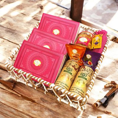 Ghasitaram Gifts Jaiccha Holi- Sweets/Holi Hampers/Thandai Brown Cane Basket of Gujiyas, Sweets/ Bites, Namkeen, Thandai and Organic Gulal