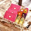 Ghasitaram Gifts Jaiccha Holi- Sweets/Holi Hampers/Thandai Brown Cane Basket of Gujiyas, Sweets/ Bites, Namkeen, Thandai and Organic Gulal view 1