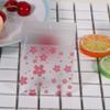 100PCS Self Adhesive Cookie Bags Resealable, Plastic Self Adhesive Wrappers Resealable Favors Candy Bag Clear Individual Treat Bags for Packaging Cookies, Candy and Products (sakura 7 * 7CM) view 2
