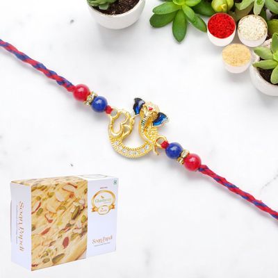 Ghasitaram Gifts Jaiccha Rakhi for Brother Rakhis Online - Om Ganesha Premium Rakhi- K-47 with 200 GMS of Soan Papdi