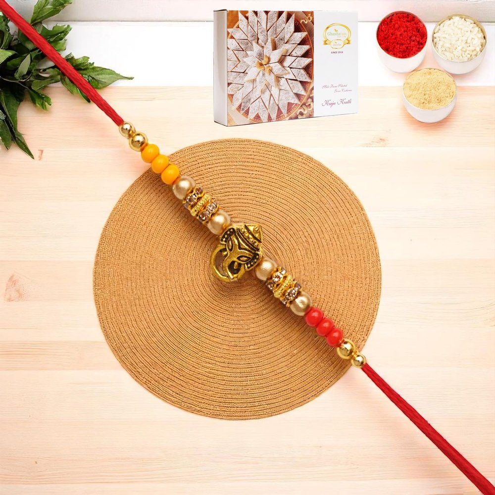 Ghasitaram Gifts Jaiccha Rakhis for Brother Rakhis Online - Y-58 Ganesha Divine Rakhi with 200 GMS of Kaju katli