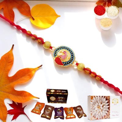 Ghasitaram Gifts Jaiccha Rakhis for Brother Rakhis Online - Y-221 Peacock Divine Rakhi with Asorted Bites Box and 200 GMS of Kaju katli