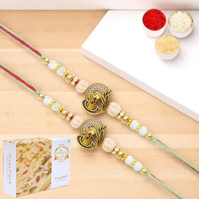 Ghasitaram Gifts Jaiccha Rakhis for Brother Rakhis Online - Set of 2 - X-87 Om Shiv Divine Rakhi with 200 GMS of Soan Papdi