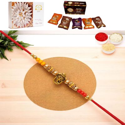 Ghasitaram Gifts Jaiccha Rakhis for Brother Rakhis Online - Y-58 Ganesha Divine Rakhi with Asorted Bites Box and 200 GMS of Kaju katli