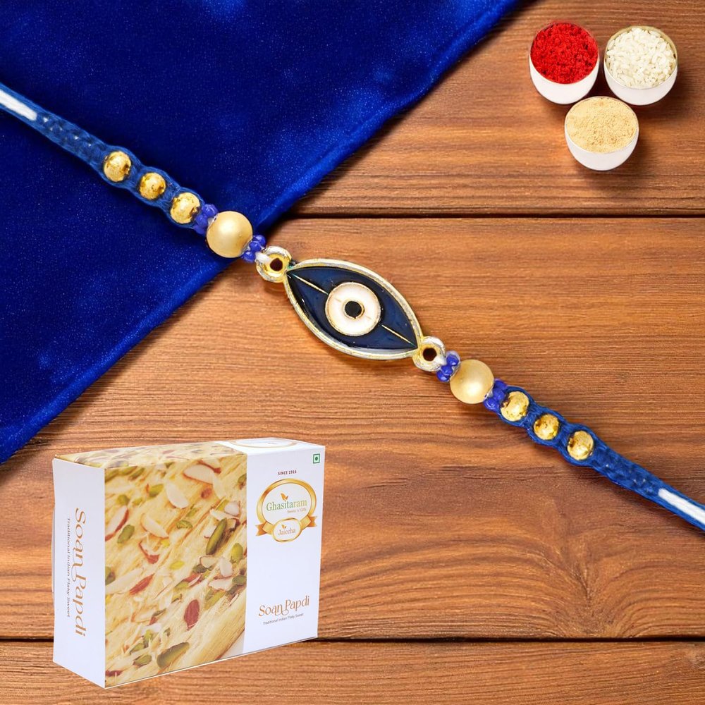Ghasitaram Gifts Jaiccha Rakhis for Brother Rakhis Online - X-86 Evil Eye Fancy Rakhi with 200 GMS of Soan Papdi