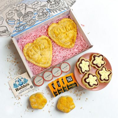 Pre-Order Now For Delivery From 12th March, The Large Heart & Tea Box With Cream Tea for 4, 2 Large Heart Shaped Mum Pasties, 4 Flower Shaped Scones, 1 Clotted Cream, 4 Jam and 4 Tea