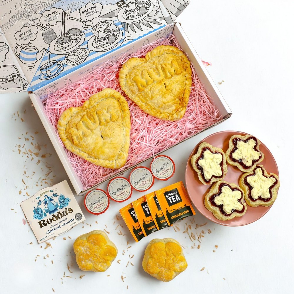 Pre-Order Now For Delivery From 12th March, The Large Heart & Tea Box With Cream Tea for 4, 2 Large Heart Shaped Mum Pasties, 4 Flower Shaped Scones, 1 Clotted Cream, 4 Jam and 4 Tea